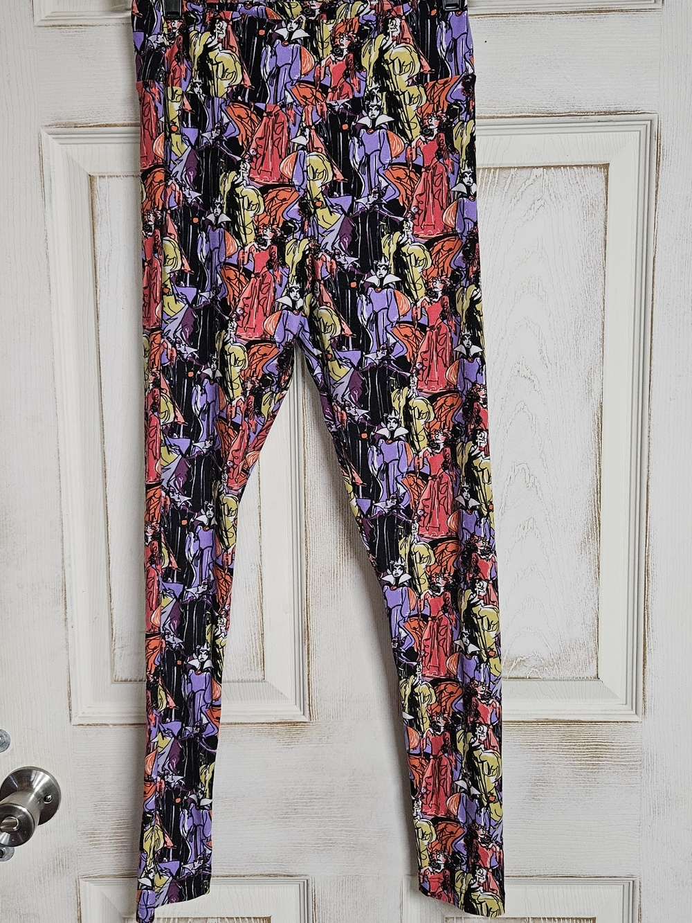 LuLaRoe Black Leggings with Red, Purple & Yellow Character Print